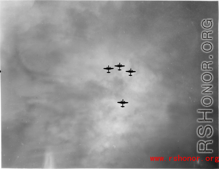 B-25 Mitchell bombers in flight in the CBI near an American air base, in the area of southern China, Indochina, or Burma. During WWII.