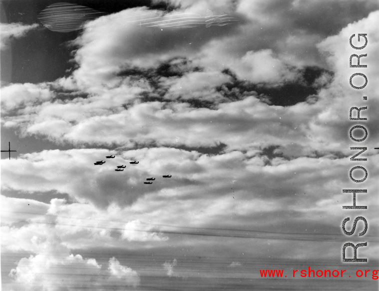 B-25 Mitchell bombers in flight in the CBI, in the area of southern China, Indochina, or Burma.