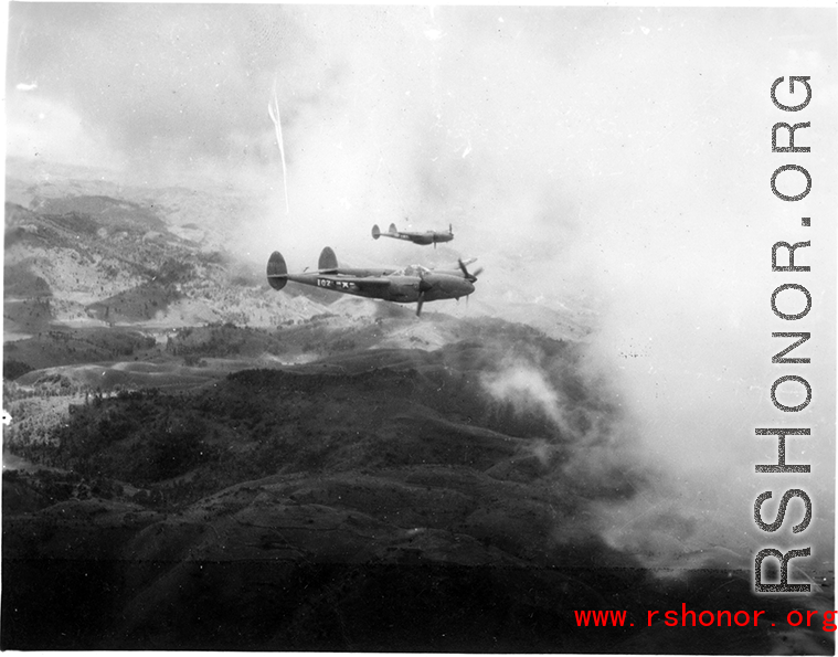 P-38s in flight in the CBI, in the area of southern China, Indochina, or Burma, during WWII.