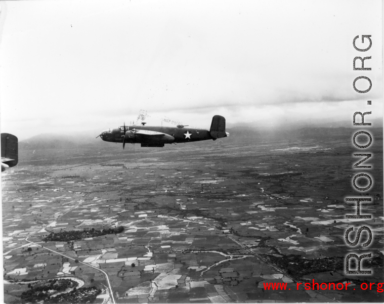 B-25 Mitchell bombers in flight in the CBI, in the area of southern China, Indochina, or Burma.