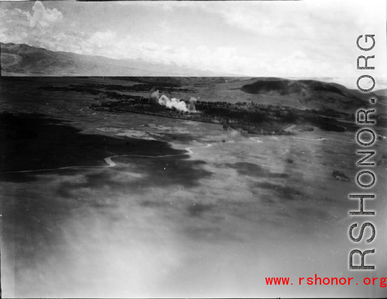 View of Tengchong from B-25 Mitchell bombers during battle with Japanese ground forces, flying over Tengchung (Tengchong), near the China-Burma border in far SW China.