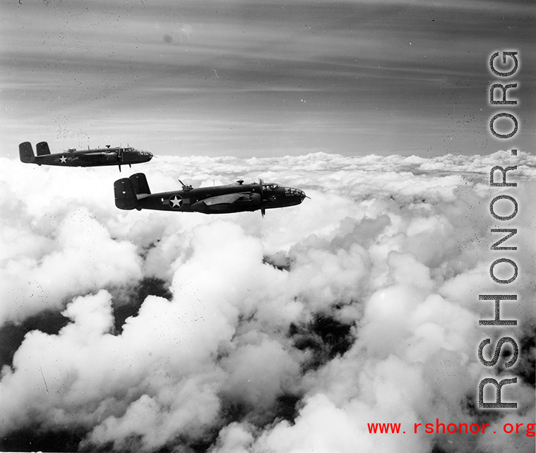 B-25 Mitchell bombers in flight in the CBI, in the area of southern China, Indochina, or Burma.