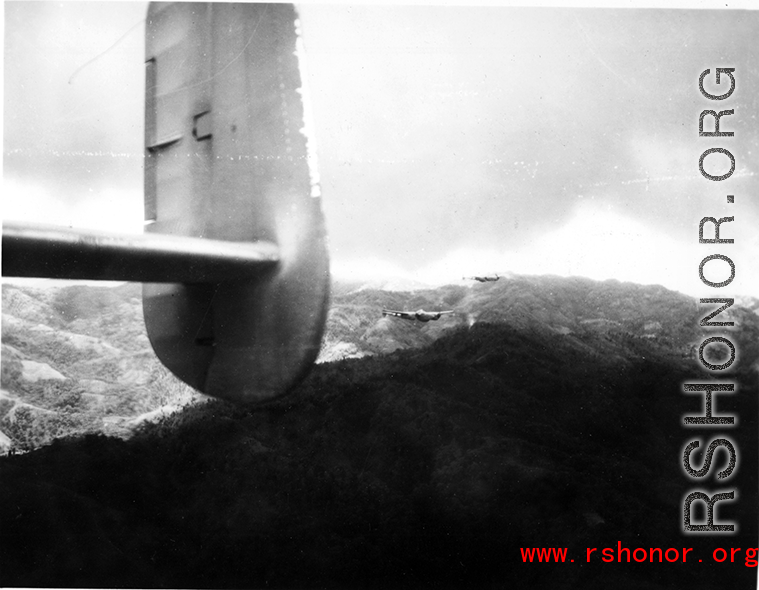 P-38s escort B-25 Mitchell bombers in the CBI--likely SW China, but maybe also Burma or Indochina.