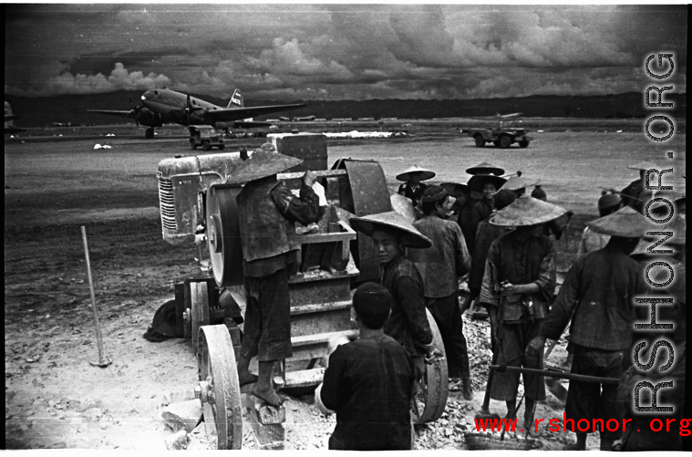 Chinese workers crush limestone for gravel and other construction needs at an American air base, Luliang.