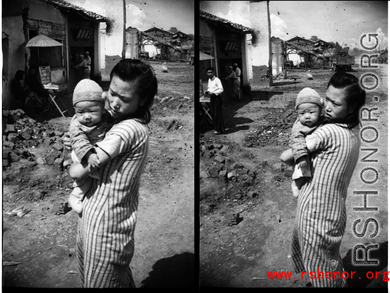 A woman holding an infant in Yunnan during WWII.