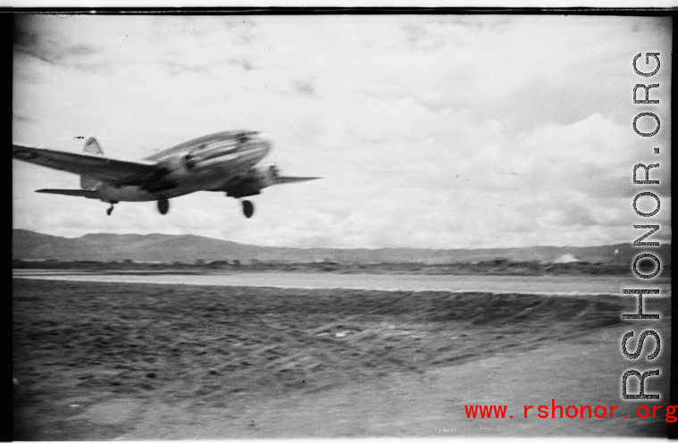 A C-46 cargo plane at an American air base in WWII in Yunnan province, China, most likely around the Luliang air base area.