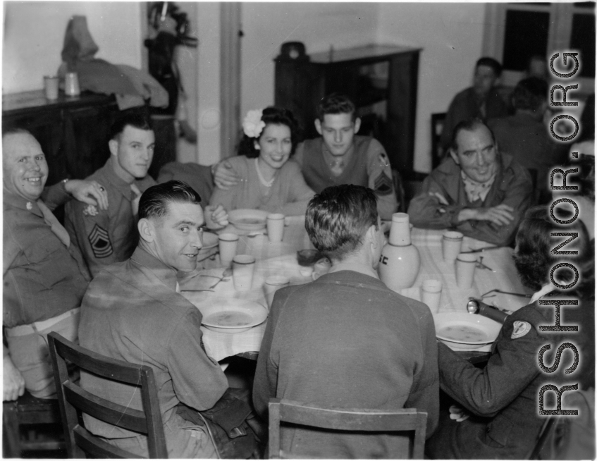 Celebrities visit and perform at Yangkai, Yunnan province, during WWII: GIs and medical staff share a meal with celebrities, including Betty Yeaton.