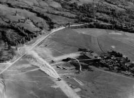 10CU 5M7 17 BURMA ROAD (RES). An Airplane prepares to take off from a rough air strip in Burma.