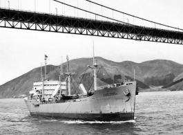 USAT Honda Knot sailing under the Golden Gate Bridge into San Francisco Bay, 10 October 1947. Honda Knot, with 3,012 World War II deceased service members for reburial in US cemeteries.	 