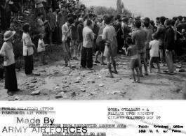 Excited civilians applaud and surround American GIs who have just returned to Liuzhou on the heels of the retreating Japanese upon the failure of the Ichigo Campaign.