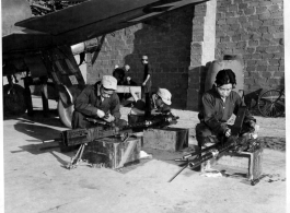 Chinese ground crews clean 50 cal. machine guns during WWII. Left to right: Sgts. Huang Wan-yi, Liu Hantao, and Toeng Tac-Han