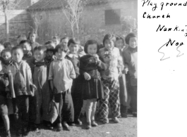 Kids play on playground at Presbyterian Church. Nanjing, November 1945.