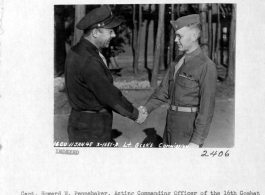 Capt. Howard W. Pennebaker of the 16th Combat Camera Unit congratulation 2nd Lt. Harold E. Geer on direct commision from T/Sgt. to 2nd Lt. January 11, 1945, in the CBI.