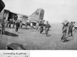 Local laborers unload supplies from an American C-47 in Mengsa or Szemao. In the CBI during WWII.