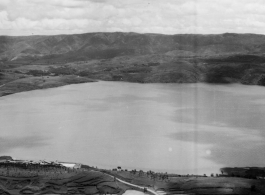 Yangzonghai lake (阳宗海) to the east of Kunming, near the U.S. Camp Schiel rest station, which can be seen in the foreground on the side of the lake.