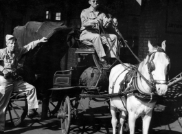GIs play with horse-drawn carriage in India during WWII.