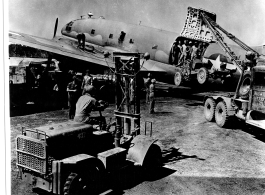 "Loading or unloading a jeep on or off of a C-46, obviously somewhere in the CBI."  Photo from Al Grasi.