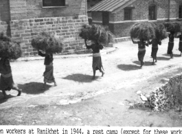 Women carrying bundle of straw or brush at the rest camp at Ranikhet in 1944, high in Himalayan mountain range of India. During WWII.