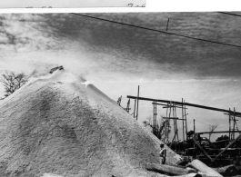 Saw dust pile at Army lumber mill during WWII in the CBI.