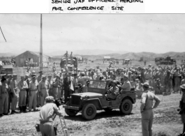 Senior Japanese officers heading for surrender conference site by jeep, during WWII.