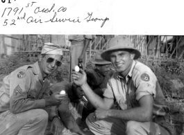 George & Montgomery buying eggs for 3 rupees each, during WWII. 1791st Ordnance Company, 52nd Service Group.