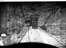 An American truck crosses the Salween River bridge during WWII.