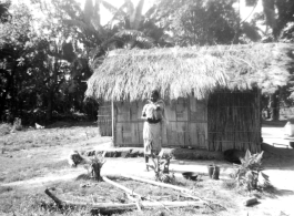 A young girl stands before a hut in India.  Local images provided to Ex-CBI Roundup by "P. Noel" showing local people and scenes around Misamari, India.    In the CBI during WWII.