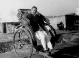 A rickshaw puller in China resting. During WWII.