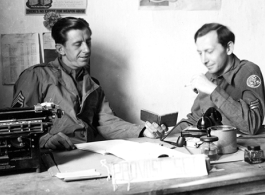 1st Sgt Roy S. Bierbauer, 491st Bomb Squadron, and S/Sgt Eugene T. Wozniak chat at the "Provost Sgt" desk in the orderly room, probably at Yangkai, China.   (Info courtesy Tony Strotman)