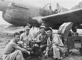 "This is another of the eight P-40's that were built from the salvage yard at Kwelin,China.The guys that are running an air speed indicator test are Art Rodriguez...Major Matthews...?...Joe Cooper. Joe was the crew chief on this project."   Notation of the nose of the plane seems to say "DEVIL'S KID" and "Mikado Raider II."