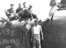 "Here is a crew from the 396th doing some salvage work on the B-24 Miss Ginny.The two guys standing are Dowds on left and Kriewitz on the right. Sitting on plane far left are Rizzo and Gerdsen. On the far right are Mayfield and Blaske. Nothing went to waste in China."