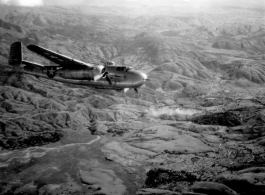 Smoke rises on the ground after an attack by American B-25s in either SW China, Indochina, or the Burma area.  This might be fairly close to Tengchong in China.