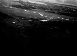 Smoke rises from B-25 Mitchell bombers attack during battle with Japanese ground forces, flying over Tengchung (Tengchong), near the China-Burma border in far SW China.