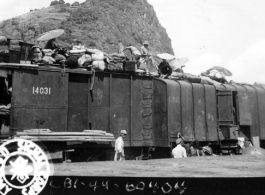 September 27, 1944  During WWII, refugees from Kweilin (Guilin) pack the top of freight cars in the south station, Liuchow, China.  Photo by Lt. N. J. Dain