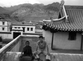 A GI of SACO poses with Lamist monk or trainee at a temple in northern China during WWII.