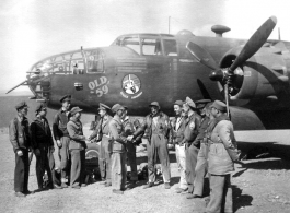 Maj. Joseph Callaway, 491st Bombardment Squadron C.O., Capt. Robert Ebey (pilot - Old 59) and 1Lt Paul Sjoberg (copilot) observe as well-wishers offer a safe journey to other crew members of "Old 59" (in flight suits), prior to departing Yangkai for the USA in March 1944.