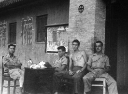 GI members of SACO and a Chinese soldier relax in northern China during WWII. 