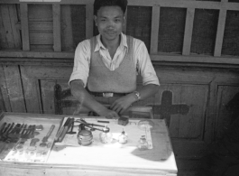 A local watch repair stand in SW China during WWII.