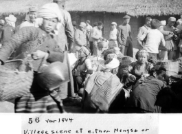 "Village scene in Mengsa or Szemao" in SW China, in 1944, during WWII. Likely market day activities.