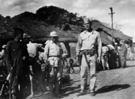 GI Joe and Chinese soldiers on a village street, probably outside of Yangkai base, Yunnan.