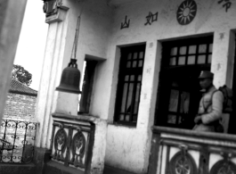 A Nationalist Chinese soldier at a Chinese military office in China during WWII.