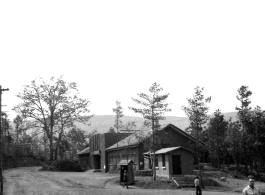 "'Last Resort' entertainment hall in Yangkai. Here the U.S. movie stars came and many time the programs were held inside. It had a stage and auditorium. An outside stage would be erected for the performances when a large crowd was present. It would be built at the same level as the stairs in the foreground, the GI's would be seated on the ground around the stage. The entertainment was sponsored by the U.S.O. The building was erected by the Chinese."