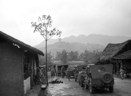 American military convoy goes through a small village in SW China. During WWII.