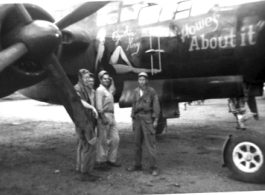 Four GIs pose in Luliang before B-25 "Howe's About It."  Henry Weiss, Tec 4, 219th Signal Depot Company, standing on the far right. During WWII.