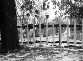 Solemn burial ceremony for American GIS who had died at a temporary war-time graveyard. In the CBI, during WWII.