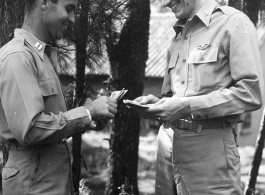 GIs count cash among pines at Yangkai air base during WWII.