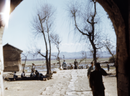 View out from a town gate in Yunnan, China, during WWII.