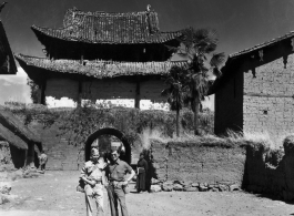 Photographer Eugene Wozniak and a language interpreter take a stroll about in Yunnan, China, during WWII.