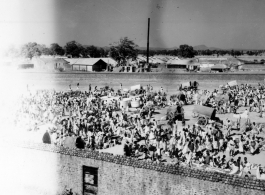 Busy market scene.  Scenes in India witnessed by American GIs during WWII. For many Americans of that era, with their limited experience traveling, the everyday sights and sounds overseas were new, intriguing, and photo worthy.