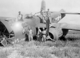 Johnson, Macaluso, Wild Bill Gornick, Lemmon pose with a crashed "Rum Runner" B-25 in Liuzhou June 1944.  William "Wild Bill" Gornick completed his required 200 combat flying hours on "Rum Runner" as it crash landed  following  a  mission against Tien Ho airbase.  Bill assisted the maintenance personnel with salvaging all the useable parts they could until he left for the USA a few days later.